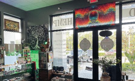 Looking towards the front door past the display cases, with the tree of life hanging on the left wall